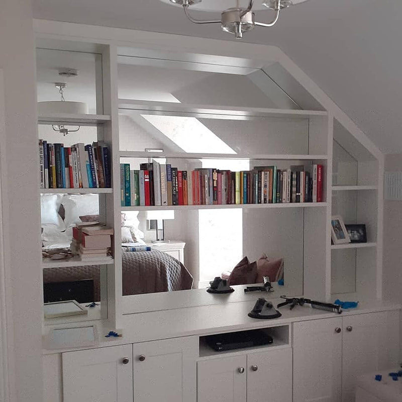 Mirrors fitted into bespoke cabinetry 